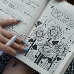 person holds book